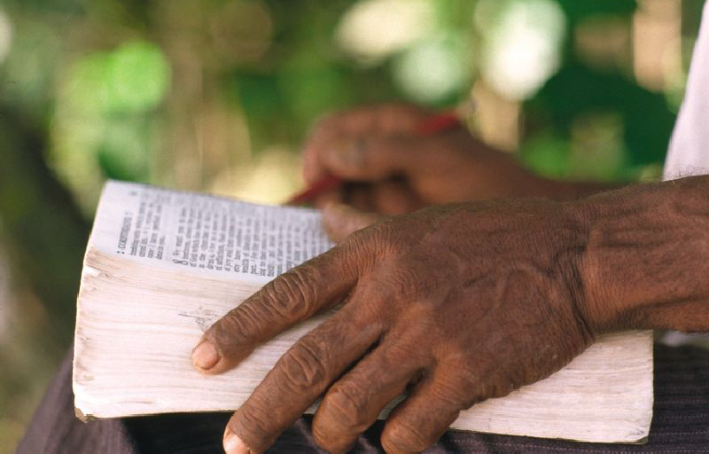 Man with Bible in his lap